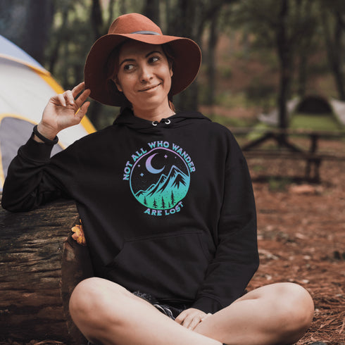 Introducing the perfect addition to your camping wardrobe - our one-of-a-kind hoodie featuring a colorful mountain graphic and the inspiring statement "Not All Who Wander Are Lost".